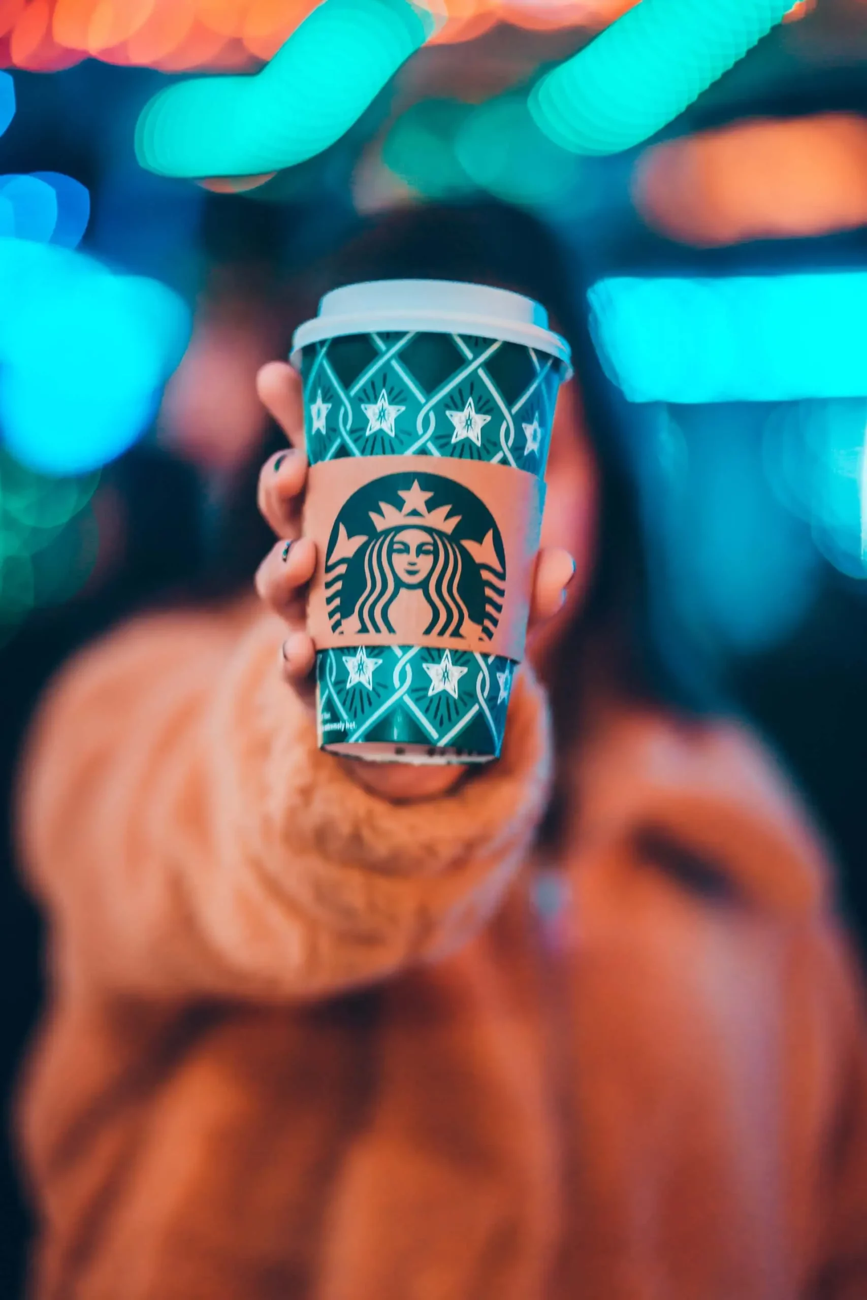 Woman holding Starbucks in her hand