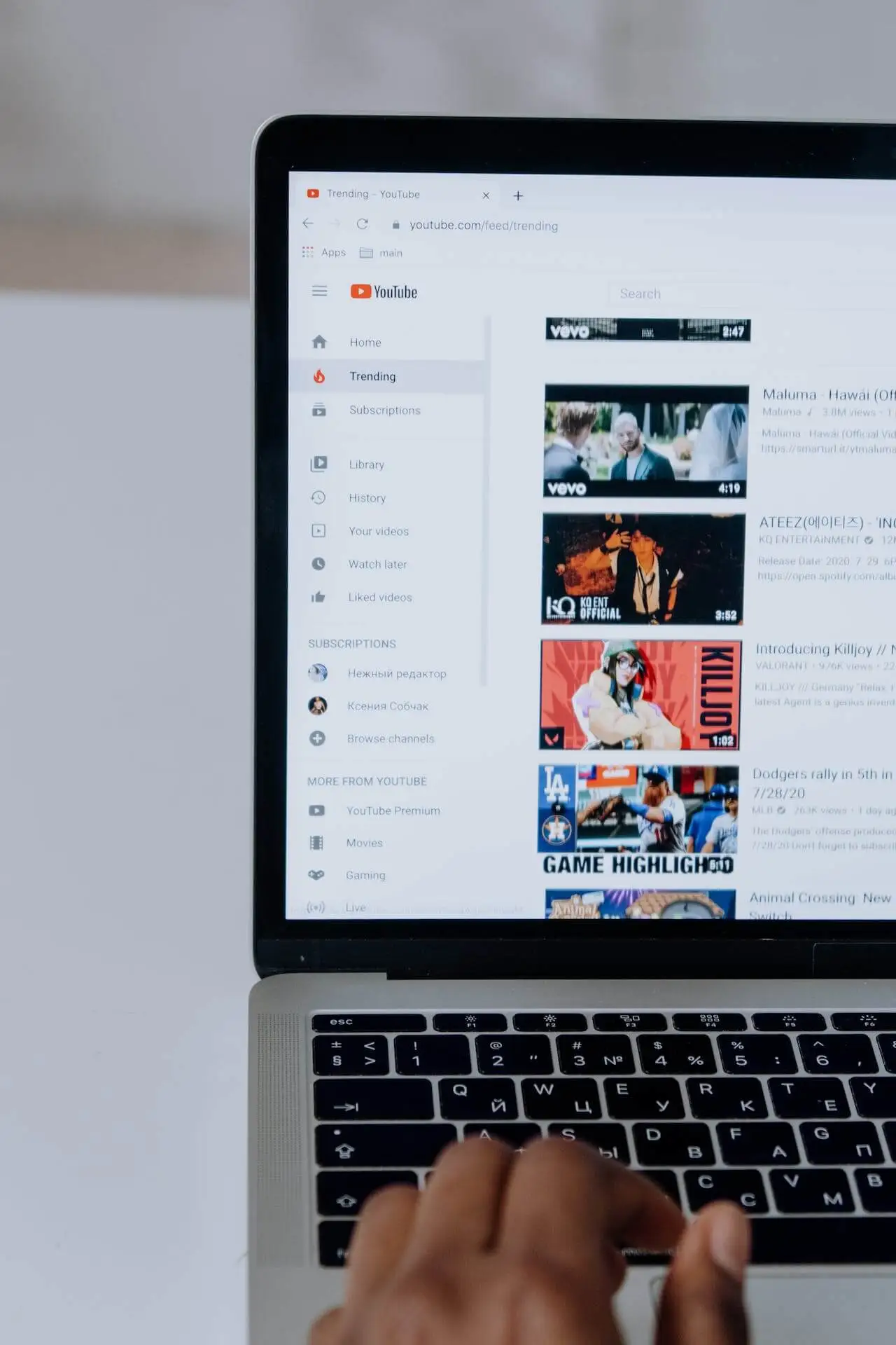 A photo displaying browsing the YouTube platform on a laptop.